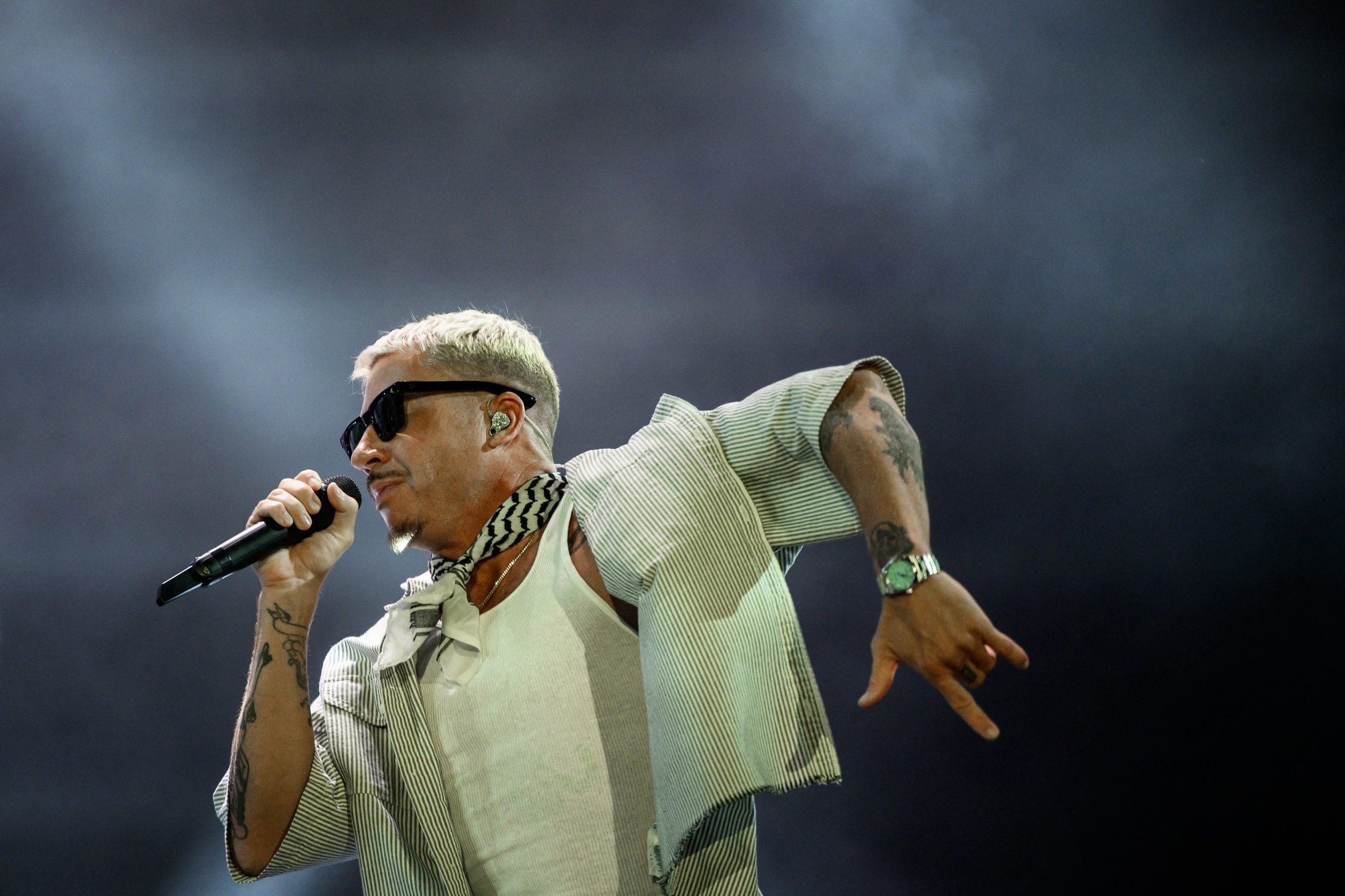 US rapper, singer, dancer and DJ, Benjamin Haggerty, known as Macklemore, performs at the Goldencoast Rap Festival in Corcelles-les-Monts, near Dijon, central-eastern France, on August 30, 2026. (Phot